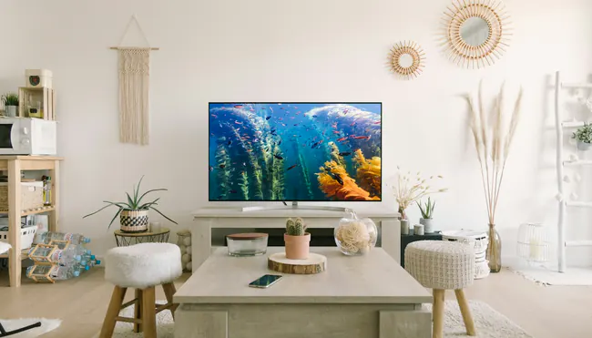 IPTV streaming on a large smart TV in a bright, modern living room